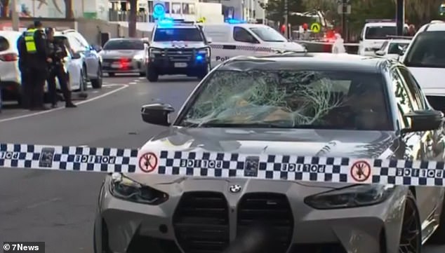 A BMW hit the woman as she rode her scooter through Surfers Paradise