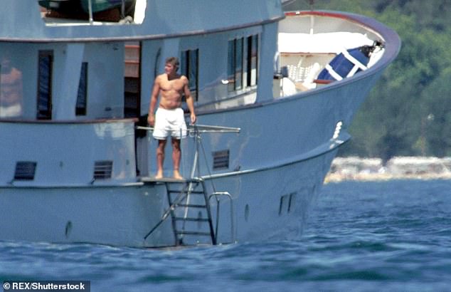 George Clooney looks out over the view from a yacht off the coast of southern France. Pictured in 2000