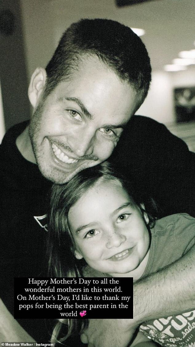 The star is pictured with her late father in 2013