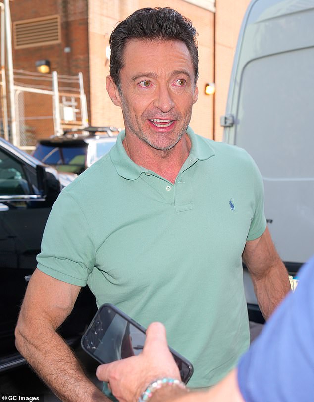 Jackman, 55, showed off his muscular arms in a mint green Ralph Lauren Polo shirt, which he paired with dark trousers