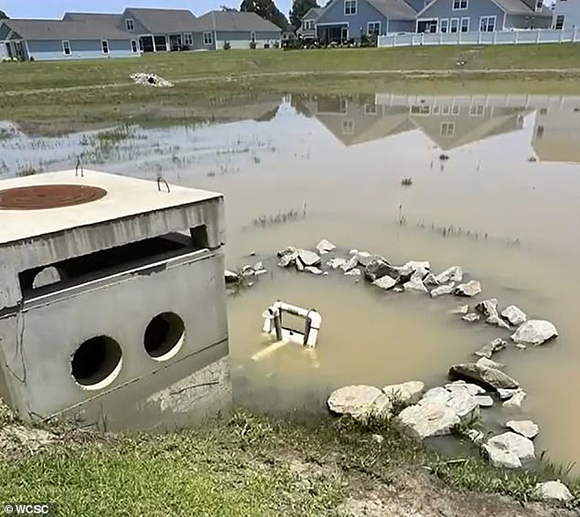 She claims that a poorly constructed rainwater pond has repeatedly flooded directly