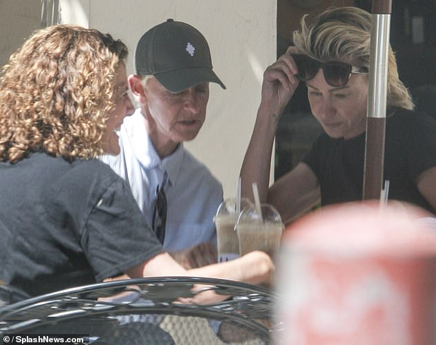 Portia and Ellen were spotted joining their friends at an outdoor table at a local deli, where they sought some shade under the umbrellas