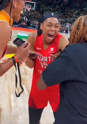 Allisha Gray celebrates winning the 3-point contest