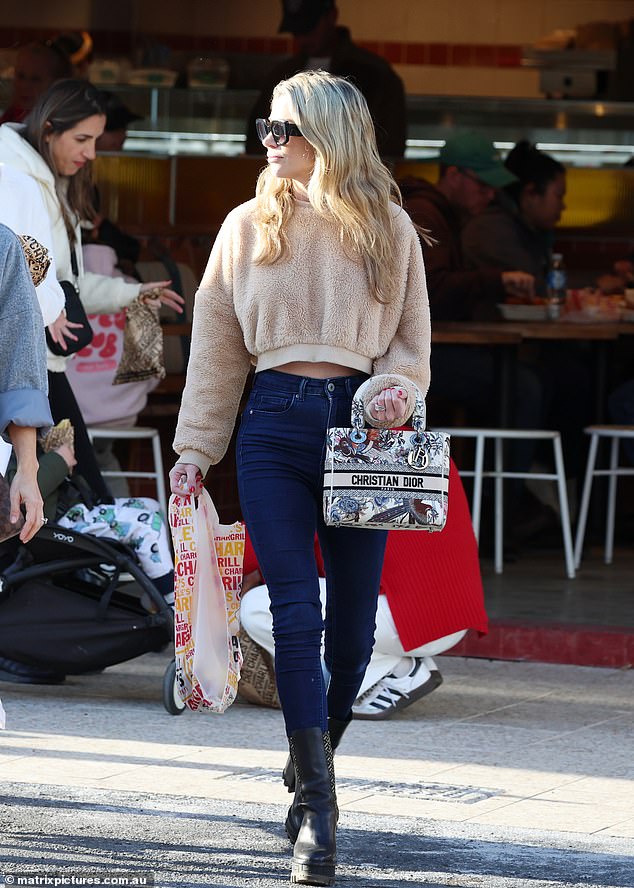 Radio titan Kyle Sandilands' wife headed to Bondi Junction. Tegan stopped at Chargrill Charlies where she picked up some chicken for dinner and headed home to her family