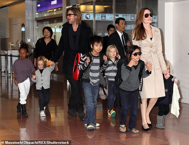 The exes have six children together: sons Maddox, 22, Pax, 20, and Knox, 15, and daughters Zahara, 19, Shiloh, 17, and Vivienne, 15 (pictured in Tokyo in November 2011)