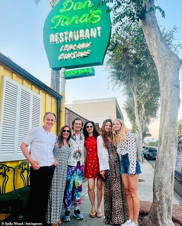 In another photo from the outing, the couple can be seen posing outside an Italian restaurant with friends