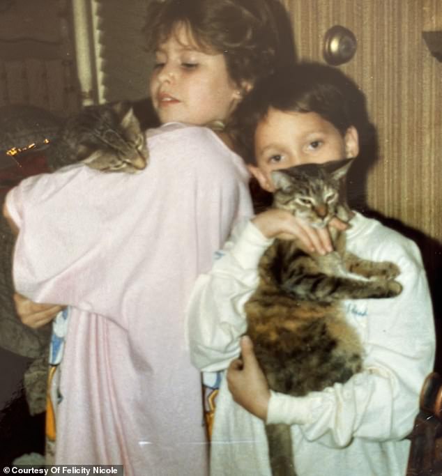 Her parents' marriage was tumultuous and as a result Felicity's childhood with a sister and two brothers was also tumultuous. Pictured is Felicity with brother Tommy and cats Frieda and Sammy