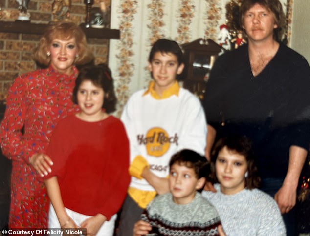 Felicity and her family and her sister's ex-fiancé, who she still considers family, are pictured here at Christmas when she was in fifth grade.