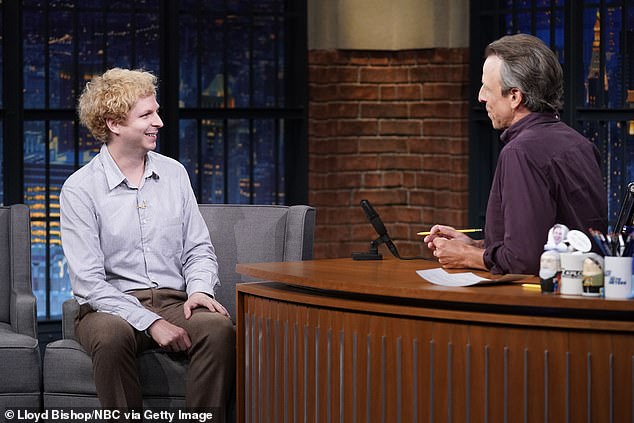 For his appearance on the late night show, the resident entertainer was clean-shaven and wore a subtle striped light blue shirt and brown pants