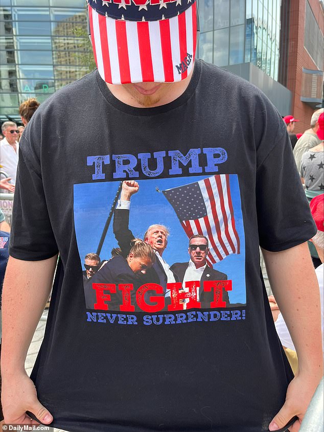 The rally participants wore shirts depicting Trump raising his fist in the air after standing up following the shooting in Butler, PA