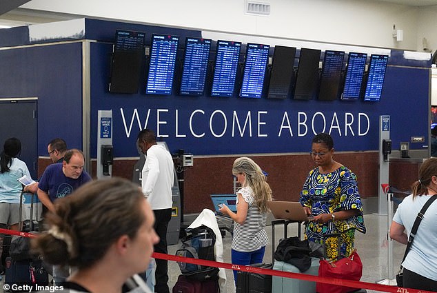 Those departing from Atlanta's Hartsfield-Jackson International Airport (pictured) are experiencing the most chaos, as more than 150 flights, or about 14 percent, were canceled and more than 30 percent were delayed on Saturday.