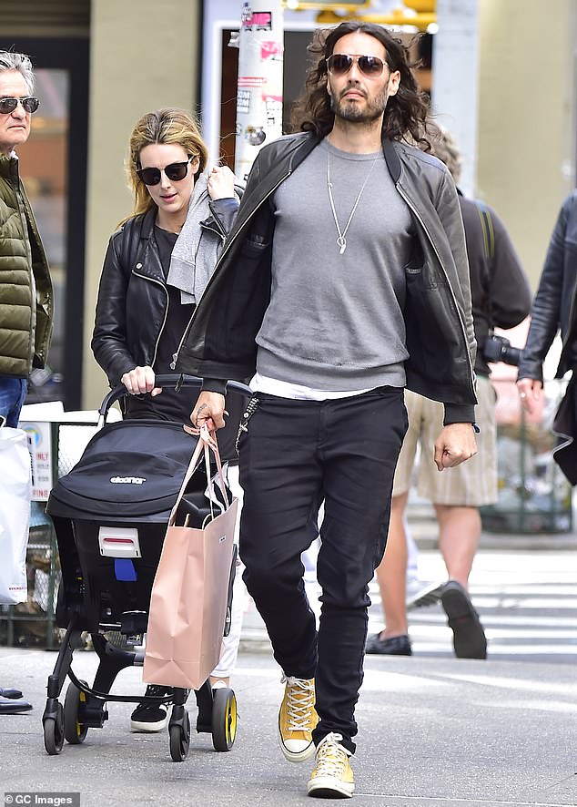 Gallacher's sister Laura (pictured) with her husband and disgraced comedian pushing a stroller in Soho, New York in 2017