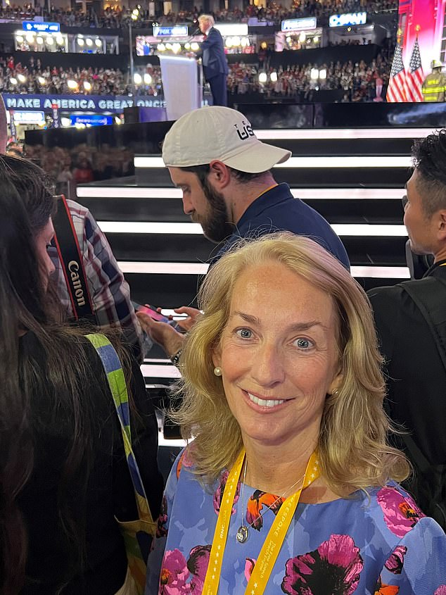 Mrs. Graham poses at the side of the stage as Donald Trump delivers his speech at the convention