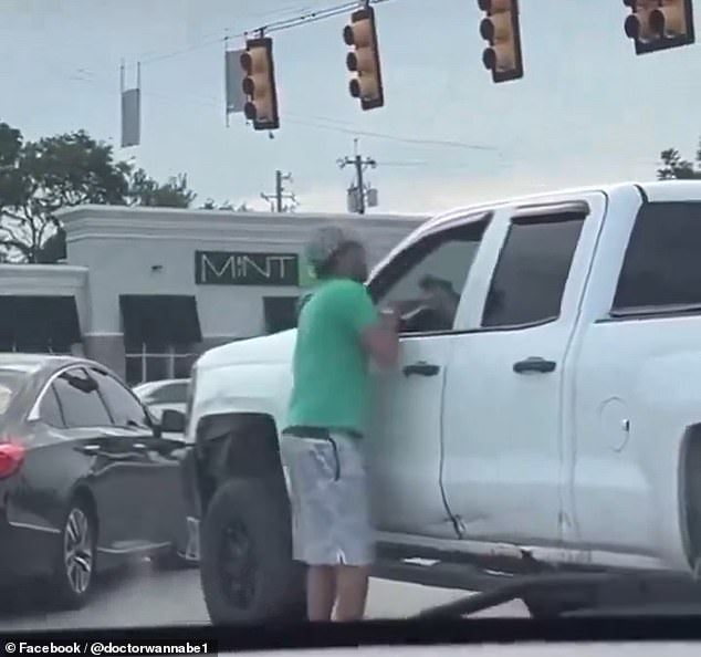 In a newly released video, Dasaur is seen arguing and attempting to punch the unidentified driver while holding what appears to be a gun on July 16.