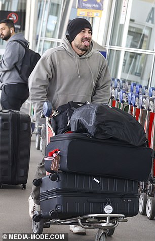 Jono was seen putting their luggage on the floor as they arrived at the airport together