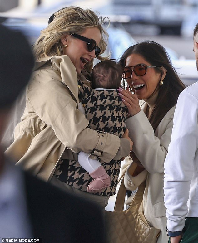 Photos showed Simone and Jono arriving to meet Amy and Aaron at the airport for their flight, and they were all seen lovingly caring for baby Gia