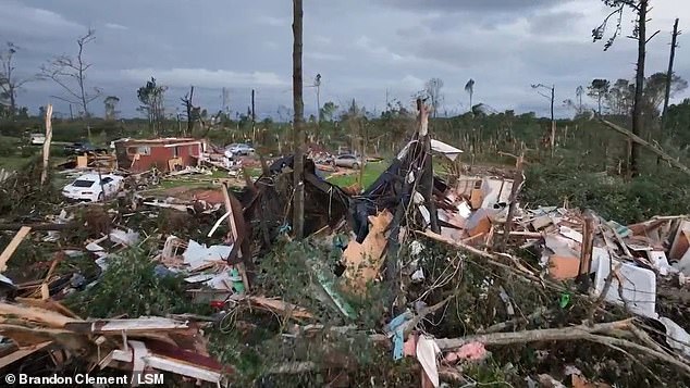 Aerial footage taken as the sun rose showed the extent of damage to homes and cars in Mississippi