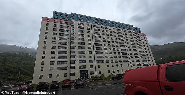 Before entering the building, the content creator explains that there are currently about 120 to 150 people living in Whittier, and “90 percent of those people live in this building.”