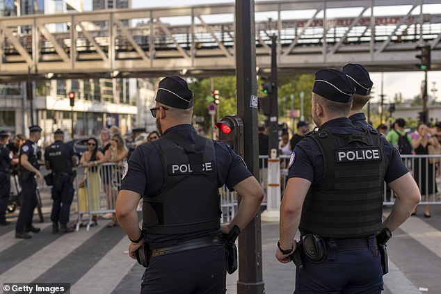 The massive security effort begins from the moment the athletes arrive in Paris until the moment they return to Israel. Pictured: Police stand guard around the security perimeter around the Seine to allow people to cross on July 20, 2024