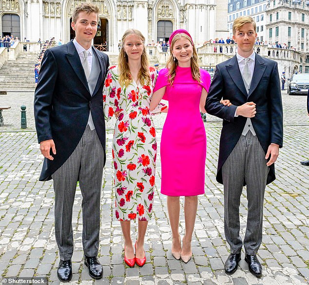 The four children of King Philippe and Queen Mathilde pose for a group photo outside the cathedral in Brussels this morning