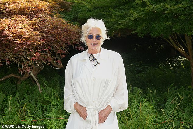 The Australian actress opted for an all-white ensemble, perfect for the outdoor theme. She chose a loose cream shirt dress, tied at the waist, paired with a white tee