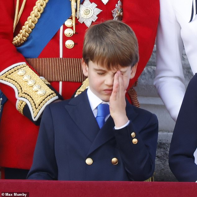 Prince Louis wipes his eye while standing on the balcony of Buckingham Palace during Trooping the Colour in June