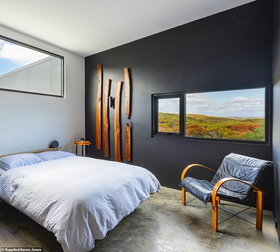 The bedroom windows open to the rugged beauty of King Island's coastal landscape