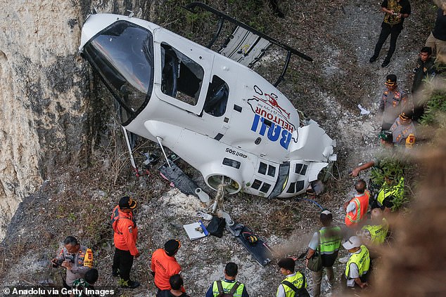 The helicopter crashed between cliffs after a pilot became stuck in the rotor blades (photo from the crash scene)