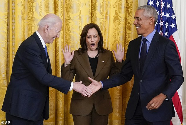 Vice President Kamala Harris reacts as President Joe Biden shakes hands with former President Barack Obama at the White House