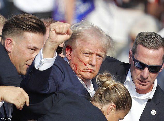 Trump is escorted off stage by Secret Service after failed assassination attempt on July 15