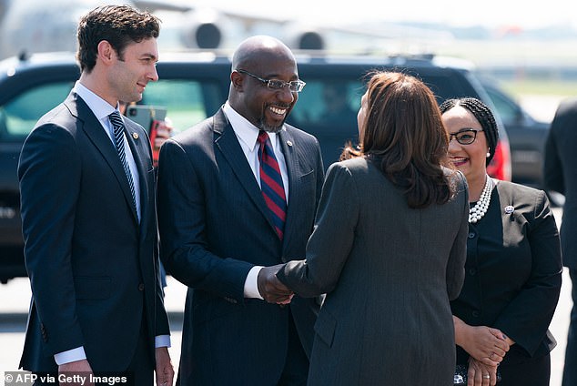 The state remains an electoral toss-up, as the GOP still holds the governor's seat, while Democrats now hold both Senate seats thanks to victories by Jon Ossoff (pictured left) and Raphael Warnock (pictured center).