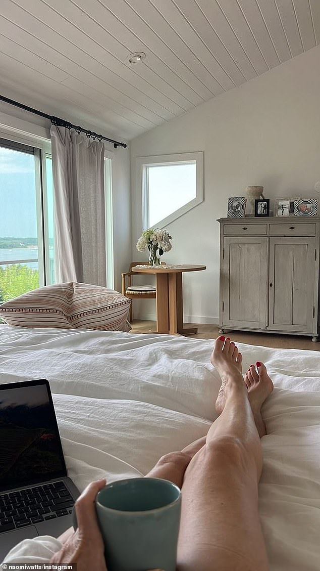 The next image seemed to show the choice she made, with Naomi's legs visible as she lay in her bed with a cup of coffee in her hand, the beautiful view of Lake Montauk she saw from her window