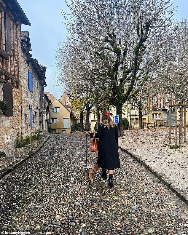 Brittany Higgins is pictured with her cavoodle, Kingston, just after moving to France in December