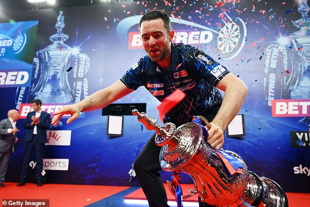 Luke Humphries pictured yesterday with the men's World Matchplay trophy