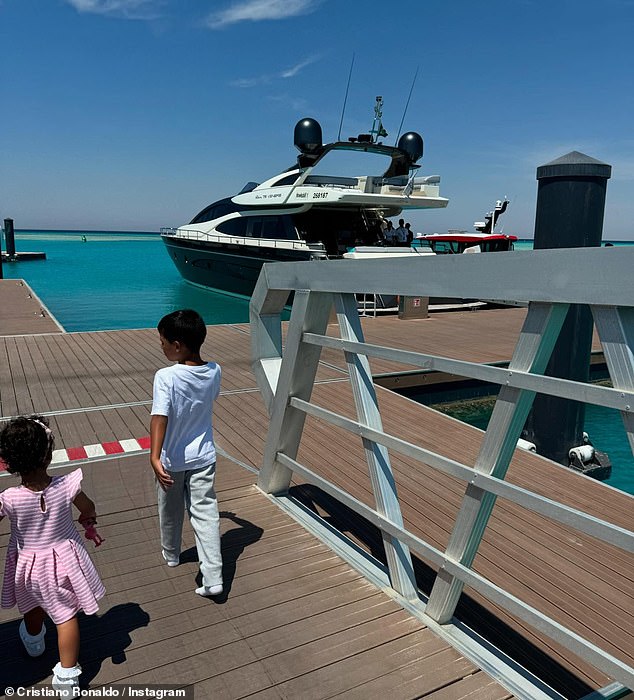 Ronaldo and Georgina's youngest daughter Bella and her son Mateo were seen in another photo walking along a jetty towards the boat