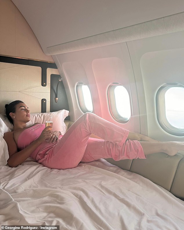 The star appeared to be in good spirits as she wore a pink Juice Couture tracksuit while traveling in a private jet