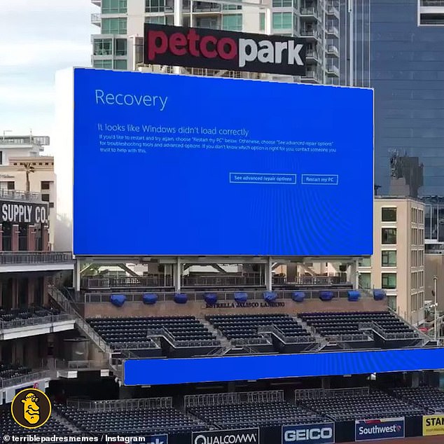 In this extraordinary photo, a Windows system in Petco Park, San Diego, California, shows the 'blue screen of death' on Friday