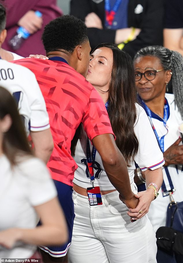 After late substitute Ollie , who scored with just seconds remaining, sent the Three Lions into Sunday's final against Spain in Berlin - he celebrated his historic win by sharing a kiss with his partner Ellie Anderson