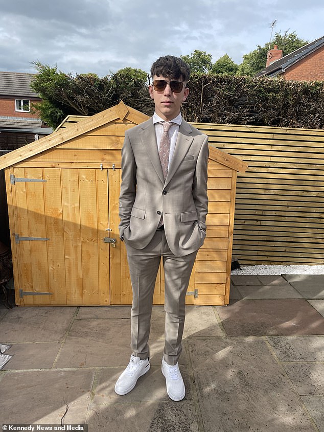 The resourceful school leaver emerged from the body bag dressed in a flashy £600 suit