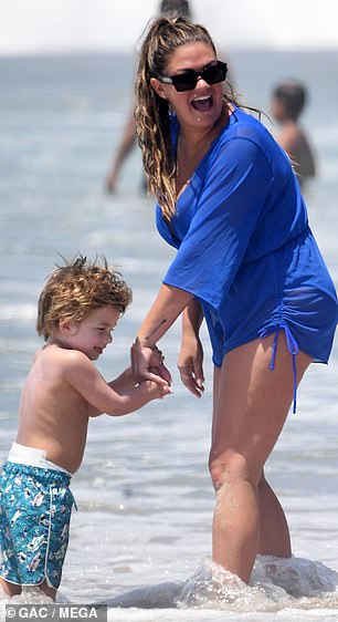 Little Cruz seemed to be thoroughly enjoying the sun with his mother