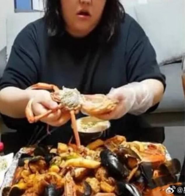 She entertained her fans by live streaming herself feasting on huge plates of food including seafood and cake