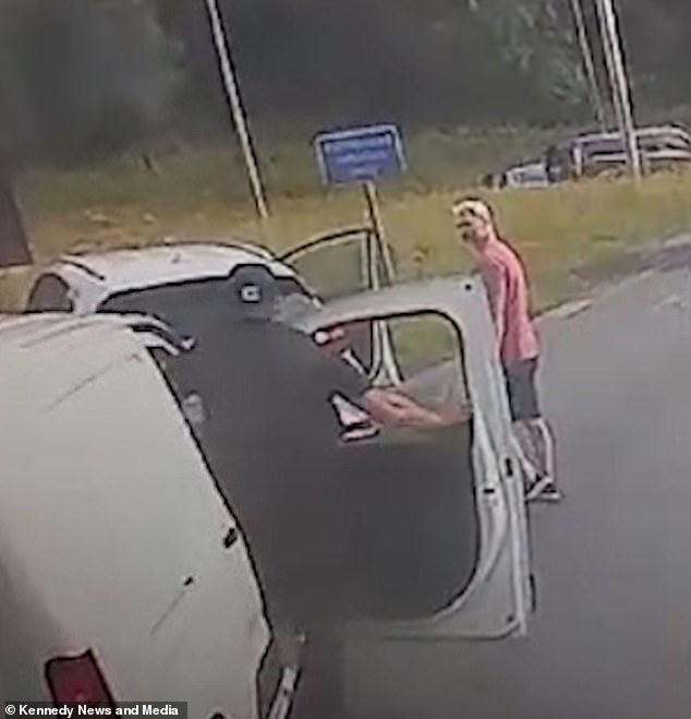 The driver of the van then opens his door and confronts the other motorist after being shouted at