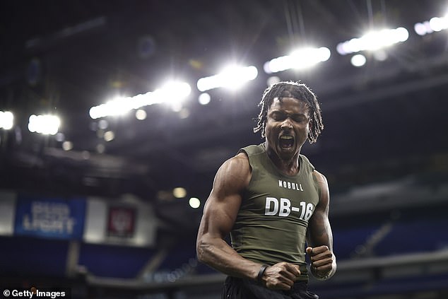 Oregon's Khyree Jackson #DB16 celebrates after a broad jump during the NFL Combine