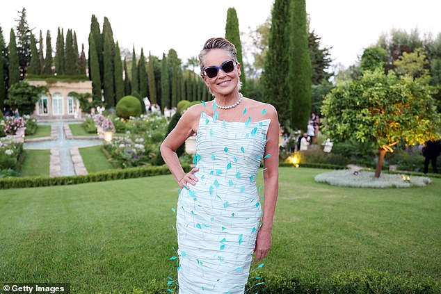 To draw attention to her dress, she combed her blonde locks back into a stylish updo