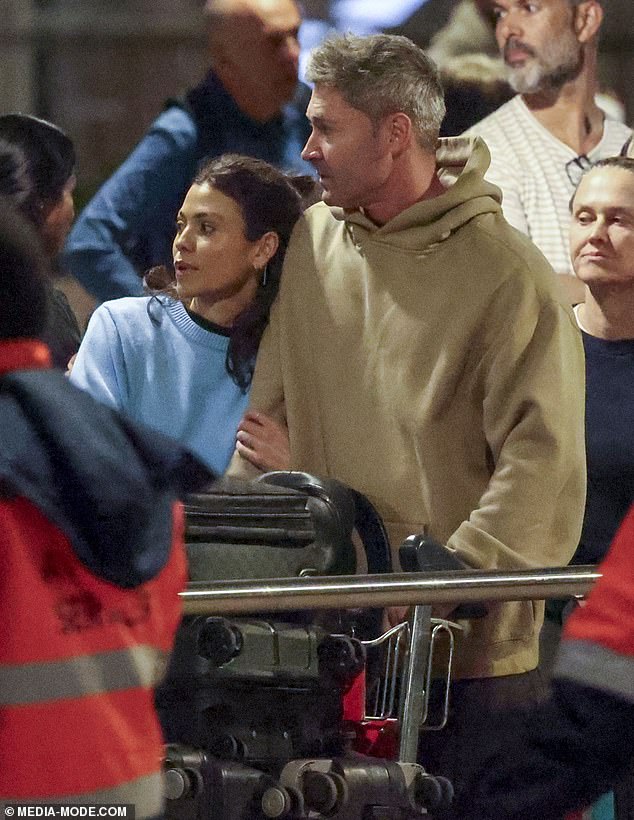 Arabella, who works for Scentre Group in Sydney, looked chic in a baby blue sweater layered over a black top tucked into loose-fitting jeans