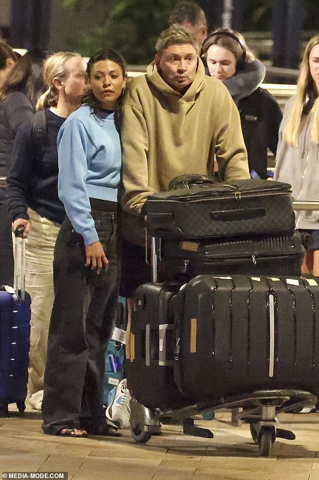 Michael Clarke and his glamorous new girlfriend Arabella Sherborne looked completely smitten on Monday as the lovebirds touched down at Sydney Airport