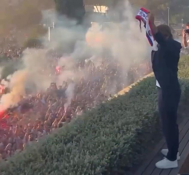 Rakitic received a hero's welcome from thousands of fans as he held up the club scarf