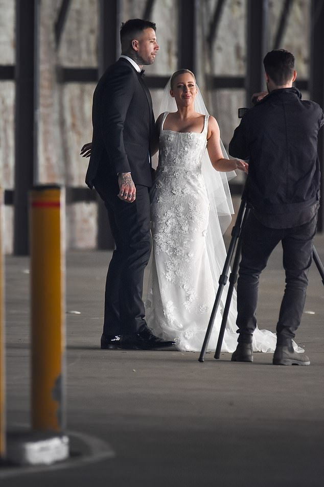 Meanwhile, his beautiful bride looked stunning in a lace wedding dress that hugged her figure