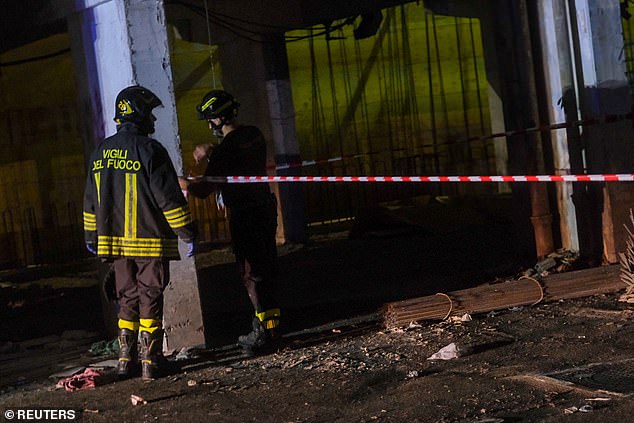 Firefighters secure the site of a collapsed balcony in Naples