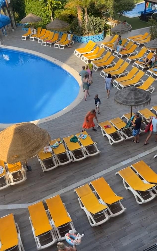 Within seconds, most of the prime spots next to the pool at the Costa Dorada hotel were already taken